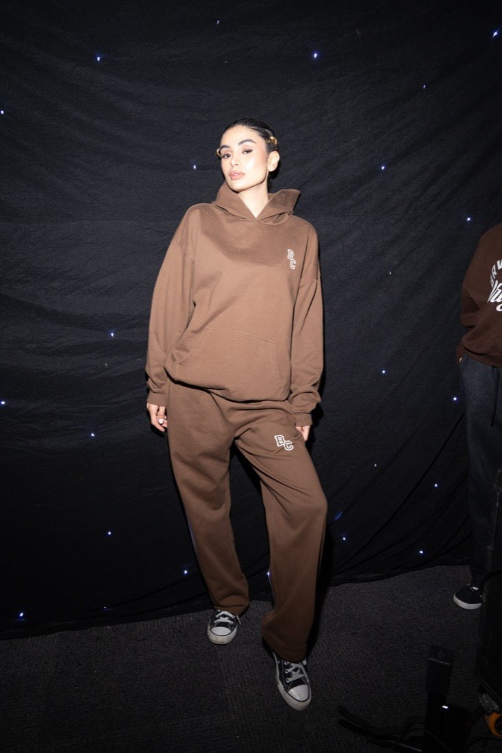BRWN CLUB runway Look 07 The Club Brown Set brown hoodie and wide-leg sweatpants